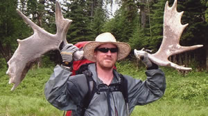 Chris Ozminski with 2 moose sheds he found on the July '05 Canadian Expedition to Grindstone Point, deep in the heart of Lake Superior Provincial Park