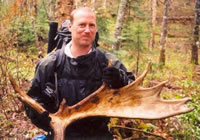 Chris Ozminski holding moose shovel