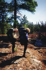 HIkers study river