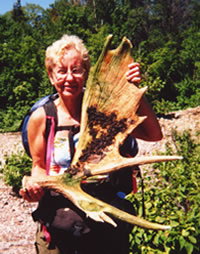 Mary Powell and a moose shed she found