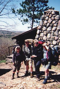 Hikers visit the Honey Moon Cabin