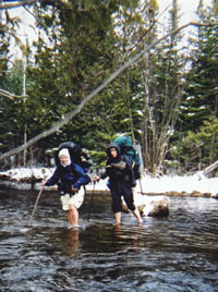 Mary Powell of Flint and Gail Bosio of Midland ford the East Branch of the Black River in Montmorency County