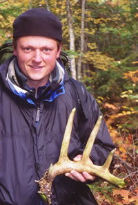 Aaron Cliff of Marquette holds a 12-point deer shed he found along the West Branch of the Yellow Dog River