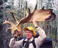 Mary Ann Hayman hold a moose shovel